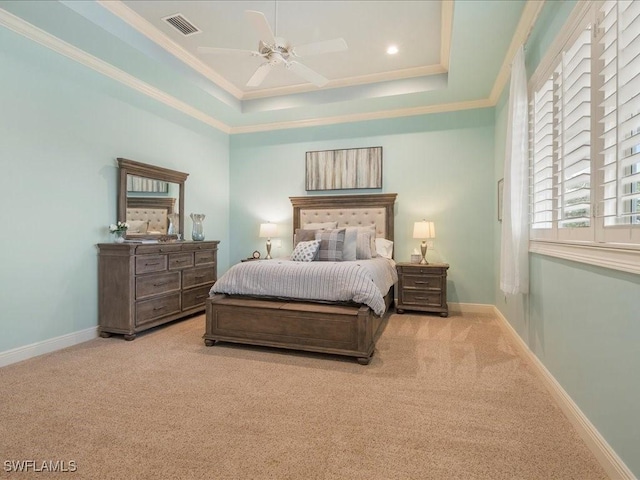 bedroom with ornamental molding, light carpet, visible vents, and baseboards