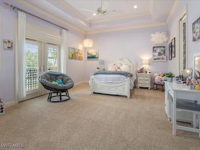 bedroom with light carpet, access to exterior, a tray ceiling, and ornamental molding