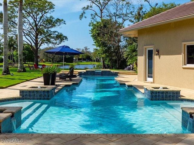 view of pool with an in ground hot tub and a lawn