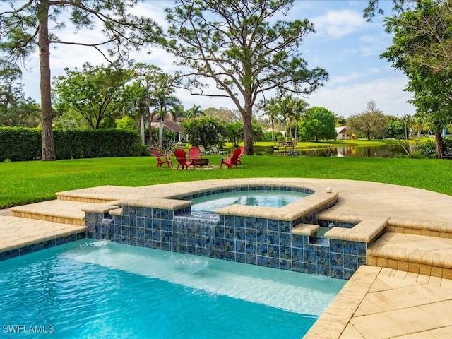 outdoor pool with an in ground hot tub, a yard, and a water view