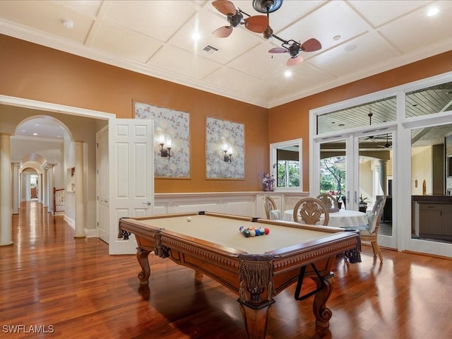 recreation room featuring visible vents, coffered ceiling, arched walkways, a ceiling fan, and wood finished floors