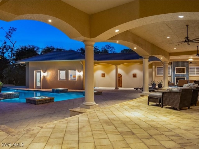 view of patio with a pool with connected hot tub, ceiling fan, and an outdoor living space