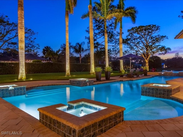 view of swimming pool with a pool with connected hot tub