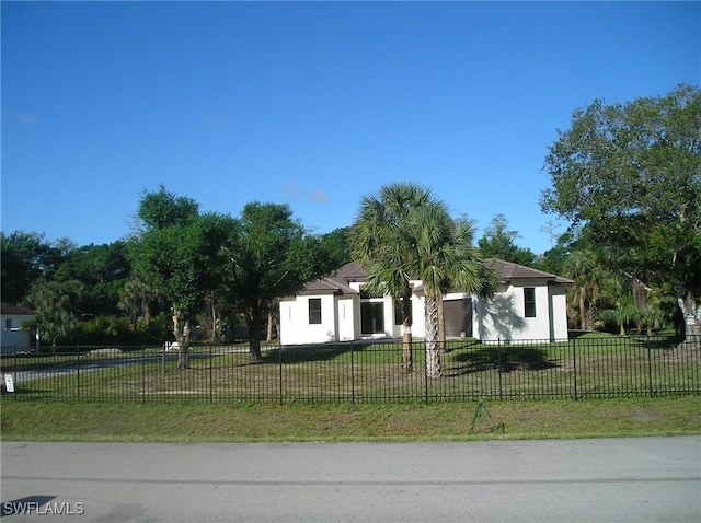 view of front of house with a fenced front yard and a front yard