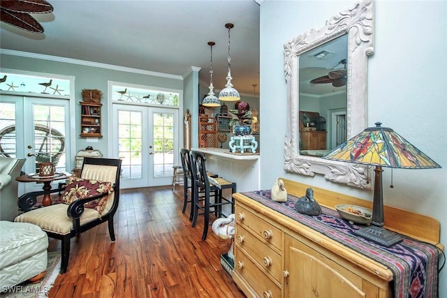 interior space featuring dark wood-style floors, crown molding, and french doors