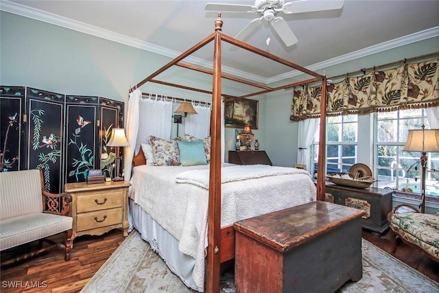 bedroom featuring ceiling fan, wood finished floors, and crown molding