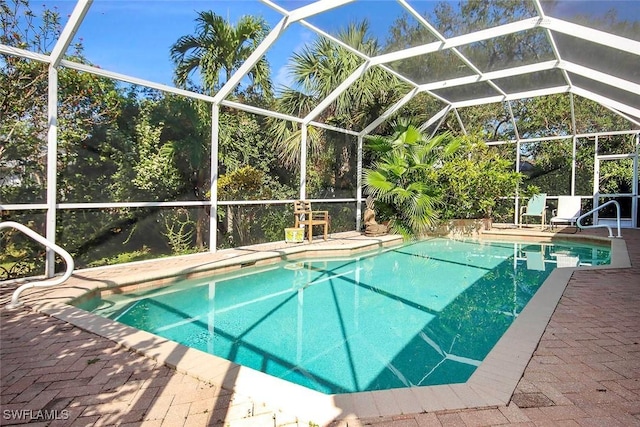 outdoor pool featuring a lanai and a patio