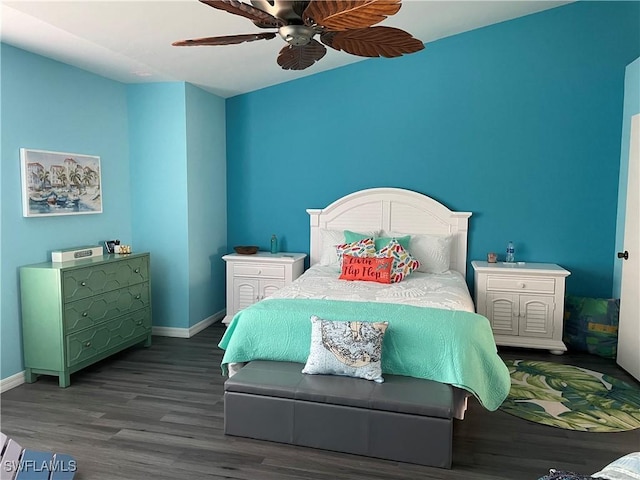 bedroom featuring ceiling fan, baseboards, and wood finished floors