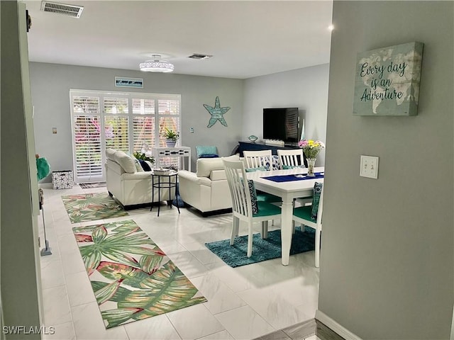 living room featuring visible vents and baseboards