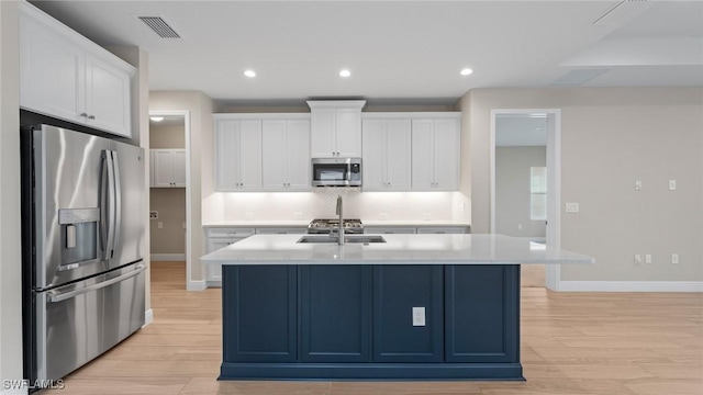 4568 Centaurus Cir, Naples, FL 34120 - kitchen with appliances with stainless steel finishes, baseboards, light wood-style flooring, and recessed lighting