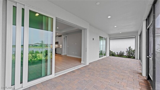 4568 Centaurus Cir, Naples, FL 34120 - view of patio / terrace featuring a water view