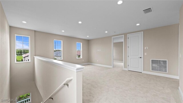 4568 Centaurus Cir, Naples, FL 34120 - unfurnished room featuring light carpet, recessed lighting, baseboards, and plenty of natural light