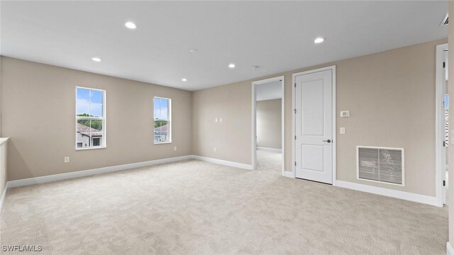 4568 Centaurus Cir, Naples, FL 34120 - spare room featuring light carpet, recessed lighting, and baseboards