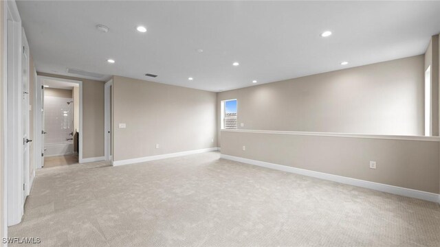 4568 Centaurus Cir, Naples, FL 34120 - spare room featuring light colored carpet, recessed lighting, baseboards, and a smoke detector
