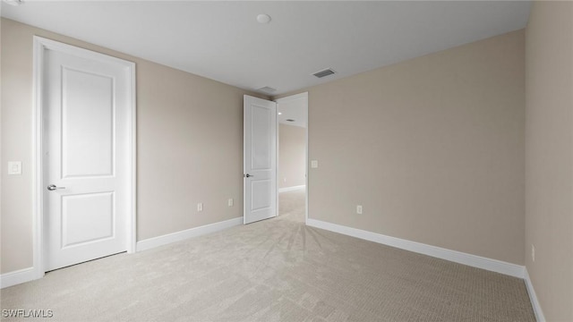 4568 Centaurus Cir, Naples, FL 34120 - unfurnished bedroom with light carpet and baseboards