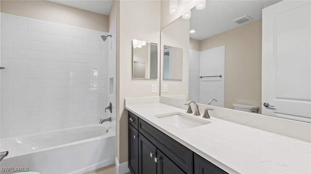 4568 Centaurus Cir, Naples, FL 34120 - full bathroom featuring toilet, vanity, and bathtub / shower combination