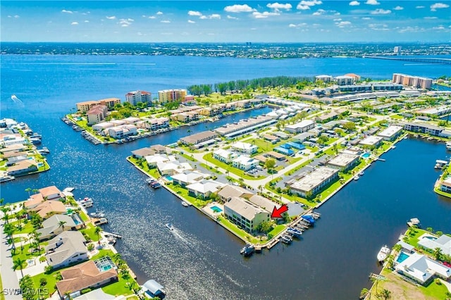 birds eye view of property featuring a water view and a view of city