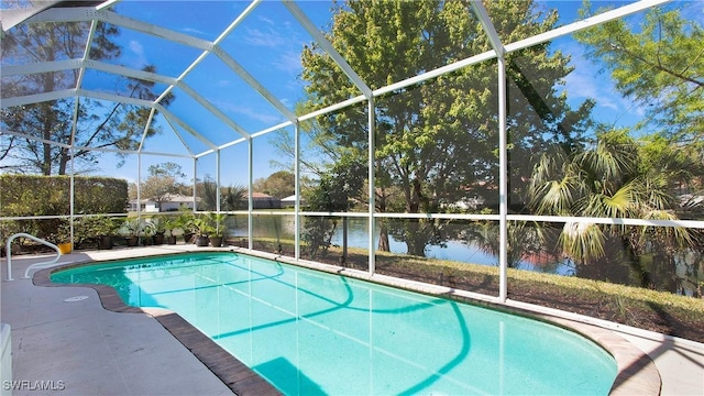 3991 Kirk Ct, Naples, FL 34116 - outdoor pool featuring glass enclosure, a water view, and a patio