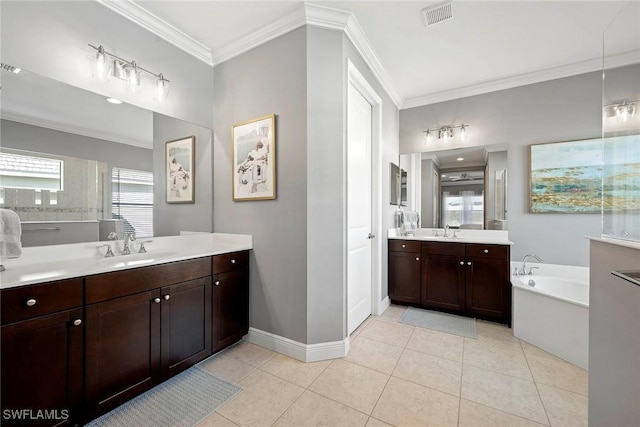 full bath with ornamental molding, two vanities, a sink, and tile patterned floors