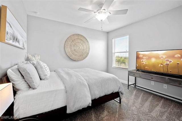 carpeted bedroom with baseboards and a ceiling fan