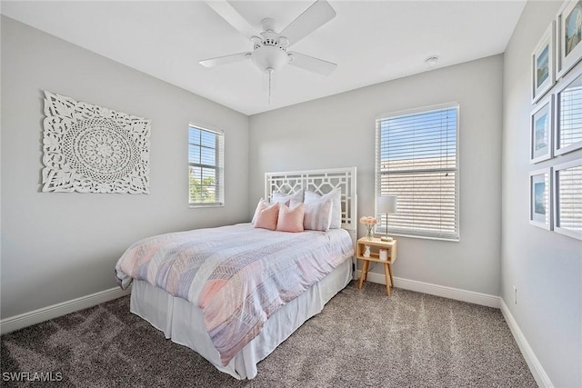 carpeted bedroom with a ceiling fan and baseboards