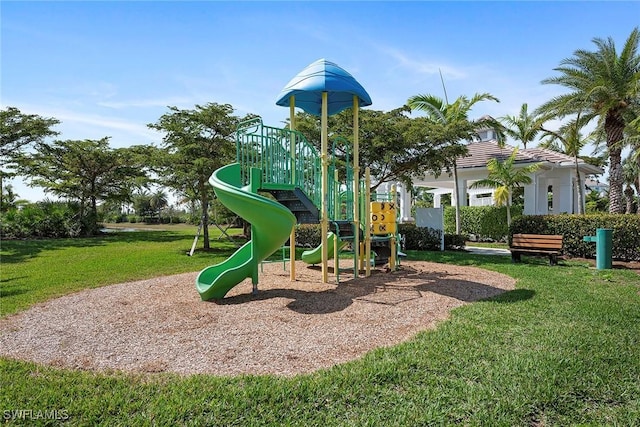 community jungle gym with a lawn