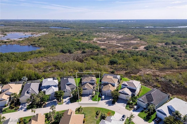 bird's eye view featuring a water view and a residential view