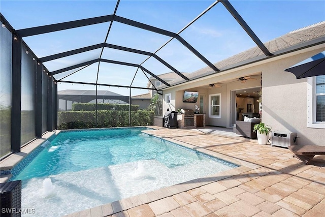 outdoor pool with a ceiling fan, a lanai, a patio area, and area for grilling