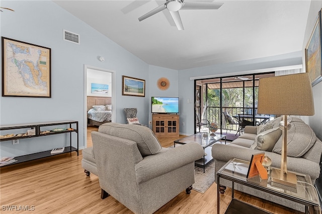 7629 Captains Harbor Dr Unit 1203, Bokeelia, FL 33922 - living room with light wood-type flooring, visible vents, ceiling fan, and lofted ceiling
