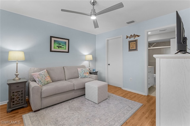 7629 Captains Harbor Dr Unit 1203, Bokeelia, FL 33922 - living room featuring visible vents, ceiling fan, baseboards, and wood finished floors