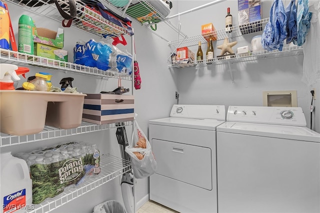 7629 Captains Harbor Dr Unit 1203, Bokeelia, FL 33922 - laundry area with light tile patterned floors, laundry area, and separate washer and dryer