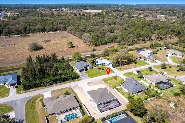 birds eye view of property with a residential view