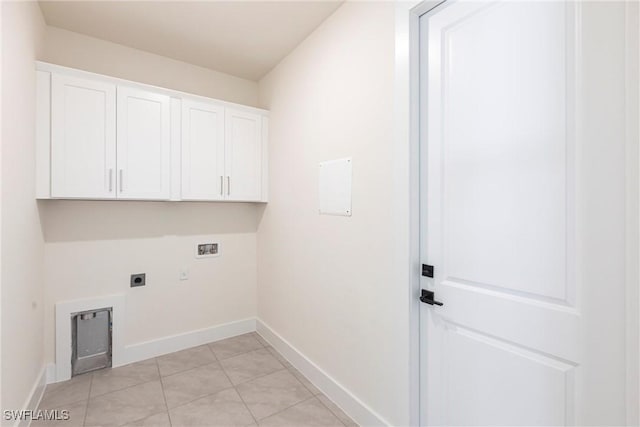 clothes washing area with cabinet space, hookup for a washing machine, baseboards, and hookup for an electric dryer