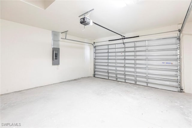 garage with electric panel and a garage door opener