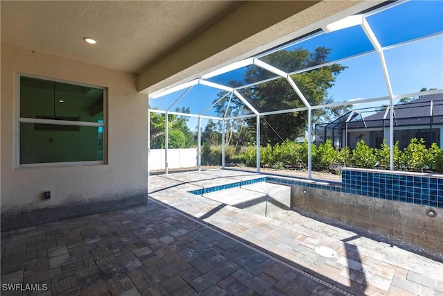 view of patio with a lanai