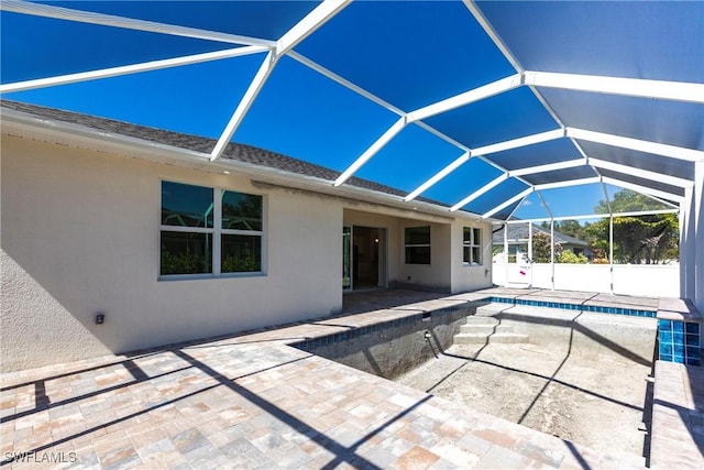 view of swimming pool featuring a fenced in pool, a lanai, and a patio area