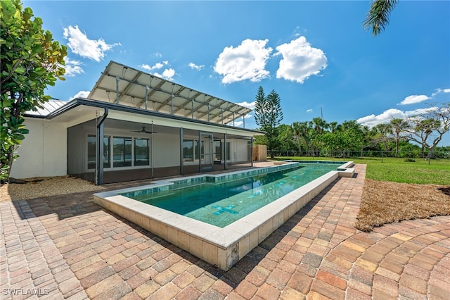 view of swimming pool featuring a ceiling fan, fence, a fenced in pool, and a patio