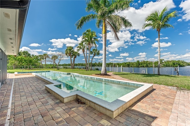 view of pool featuring a fenced in pool, a water view, fence, a yard, and a patio area