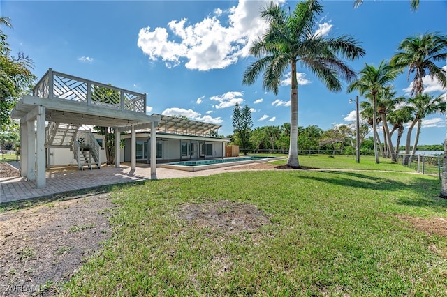 exterior space featuring fence, stairway, an outdoor pool, and a patio