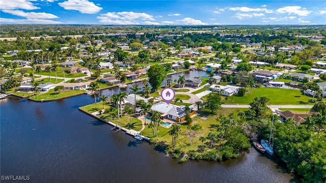 drone / aerial view with a water view and a residential view