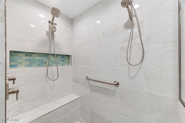 full bathroom with a tile shower