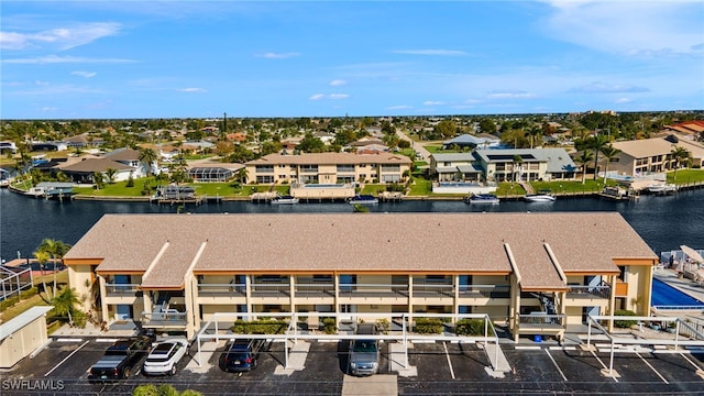 aerial view featuring a water view and a residential view