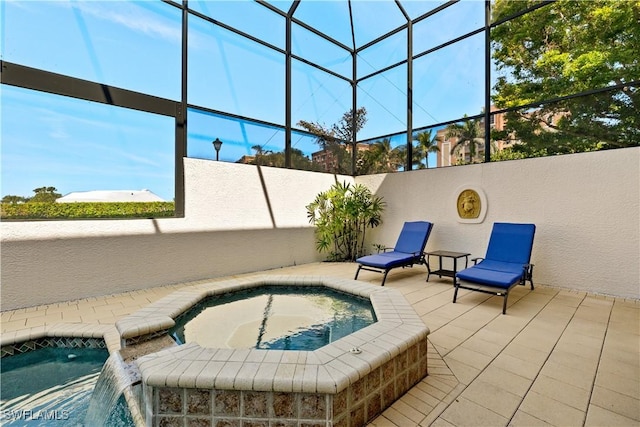 view of swimming pool featuring an in ground hot tub, a patio area, and glass enclosure