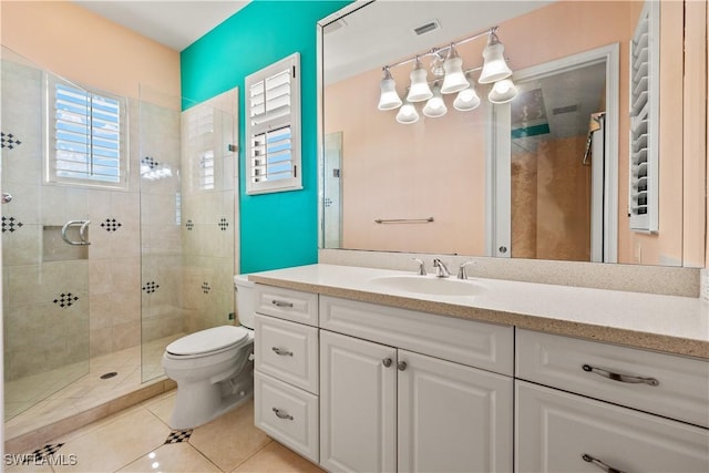 full bath featuring visible vents, toilet, a tile shower, vanity, and tile patterned flooring