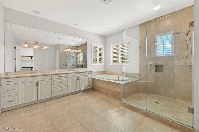 full bath featuring a stall shower, a garden tub, a sink, and double vanity