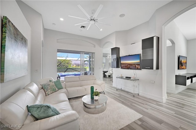 living room featuring recessed lighting, visible vents, light wood-style floors, a ceiling fan, and baseboards