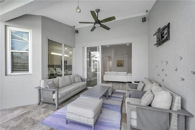 view of patio / terrace featuring a ceiling fan and an outdoor hangout area