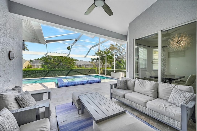 view of patio featuring a lanai, a pool with connected hot tub, and an outdoor living space