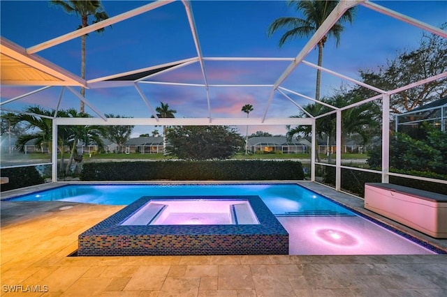 view of swimming pool with a patio, a lanai, and a pool with connected hot tub