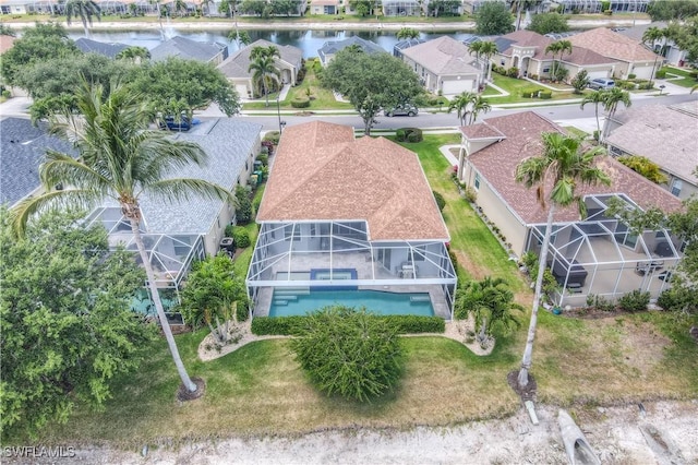8074 Tauren Ct, Naples, FL 34119 - bird's eye view featuring a water view and a residential view